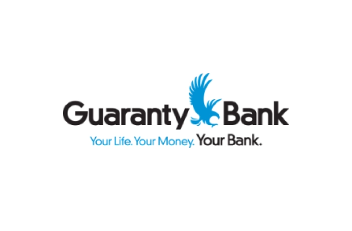 Guaranty Bank logo featuring a blue eagle in flight between the words "Guaranty" and "Bank." Below the name, the slogan reads: "Your Life. Your Money. Your Bank." in black and blue text.