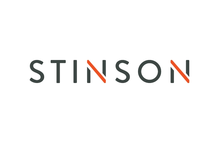 The word "STINSON" in black capital letters on a white background, with the diagonal lines of the letters "N" in orange, creating a visual accent.